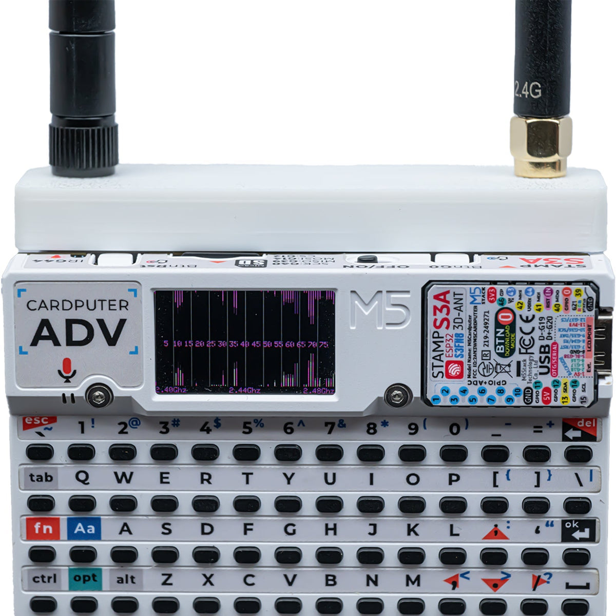 White Hydra case on Cardputer ADV with both antennas; waterfall scan on screen