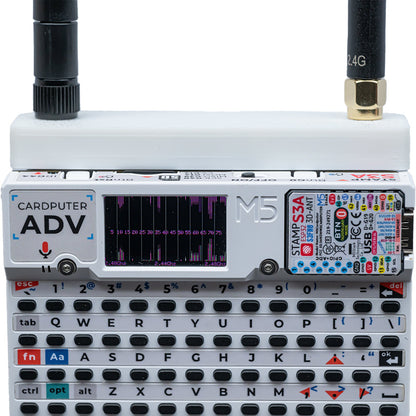 White Hydra case on Cardputer ADV with both antennas; waterfall scan on screen