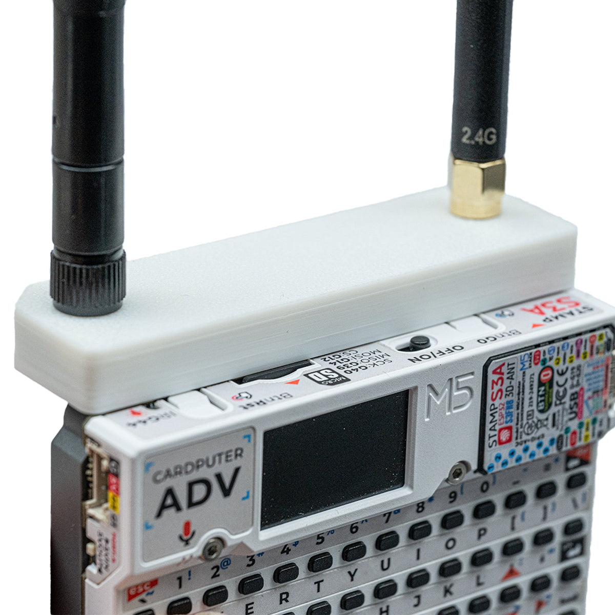 Angled close-up of the white Hydra case on Cardputer ADV with 2.4G stub