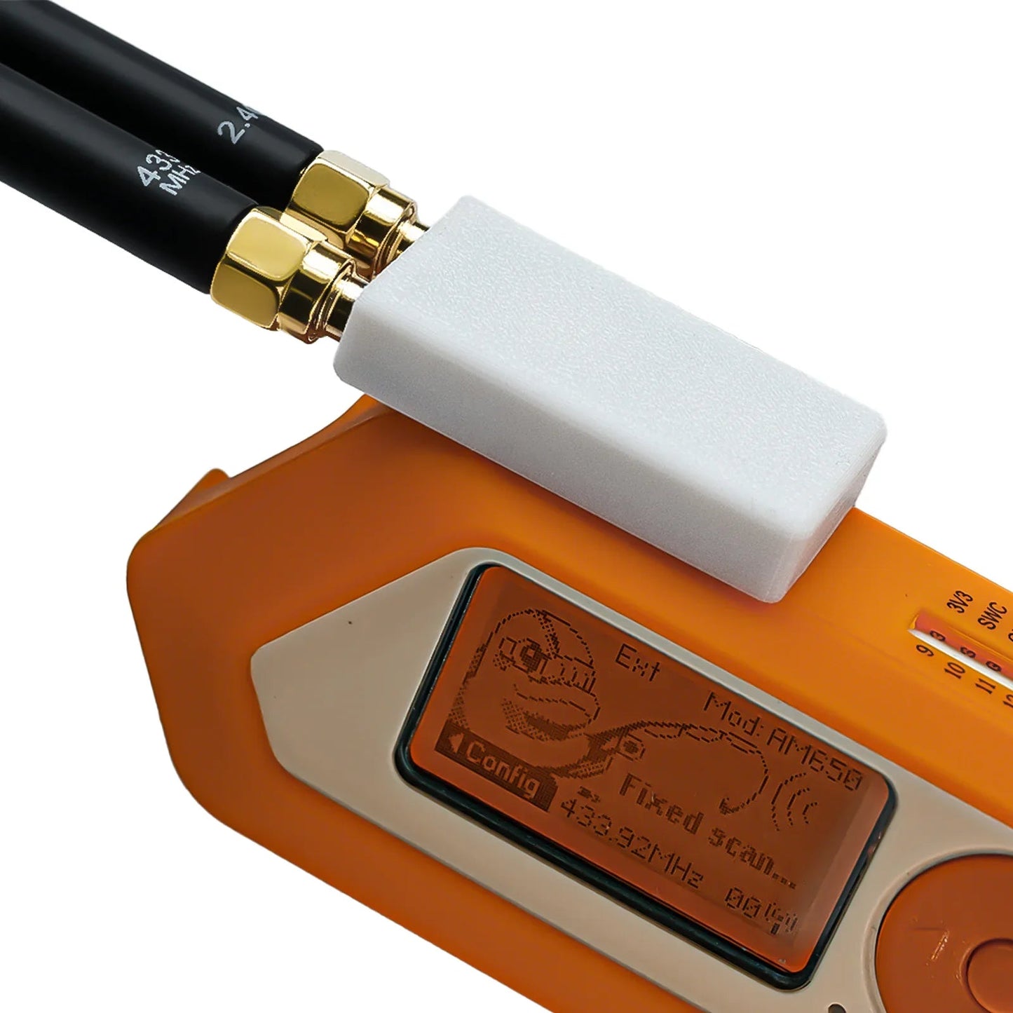 White cover installed over the 2-in-1 on Flipper Zero; Sub-GHz scan on the orange screen