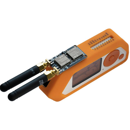 RF Lab 2-in-1 module plugged into an orange Flipper Zero with 2.4 GHz and 433 MHz antennas